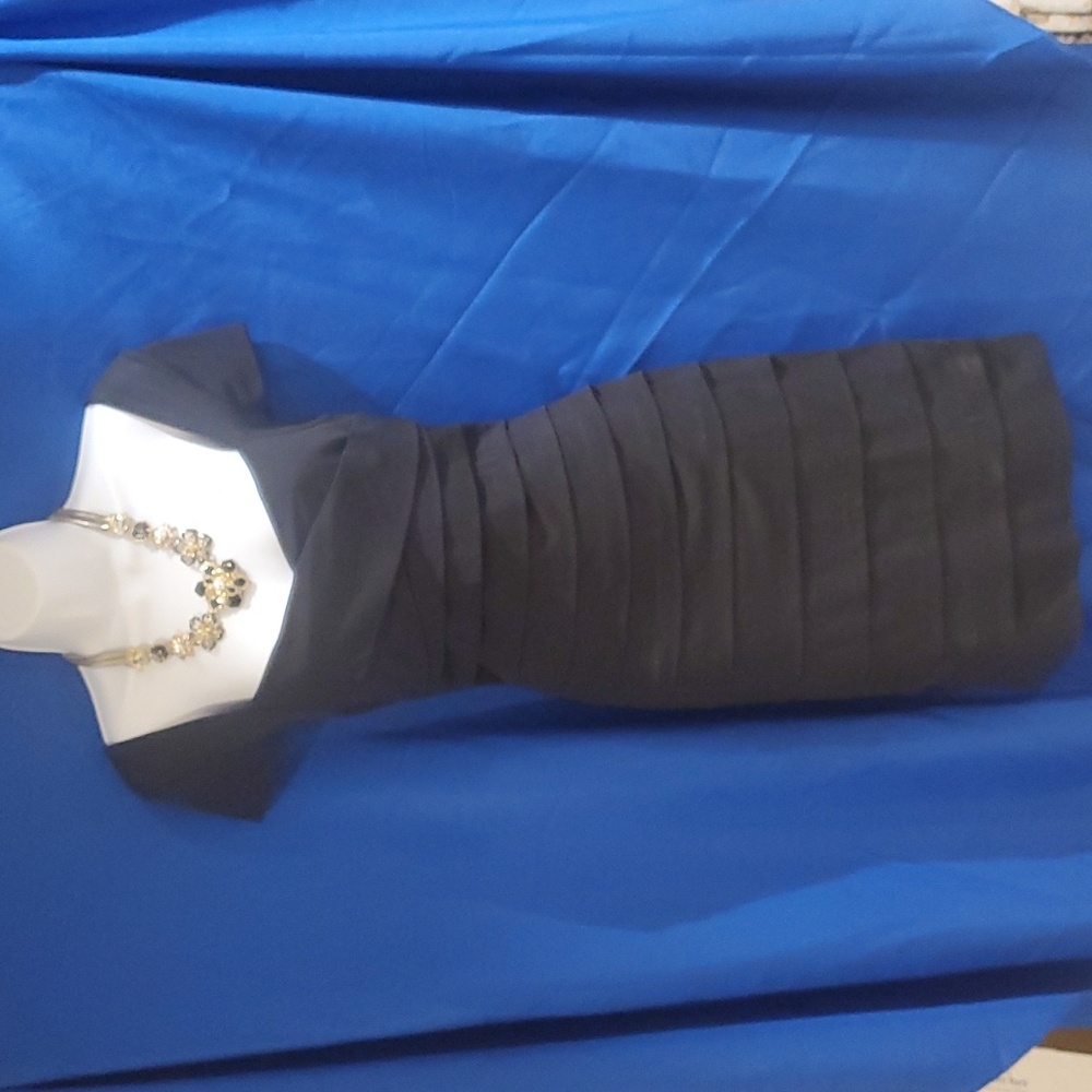 White House Black Market black cocktail dress with necklace and earrings.